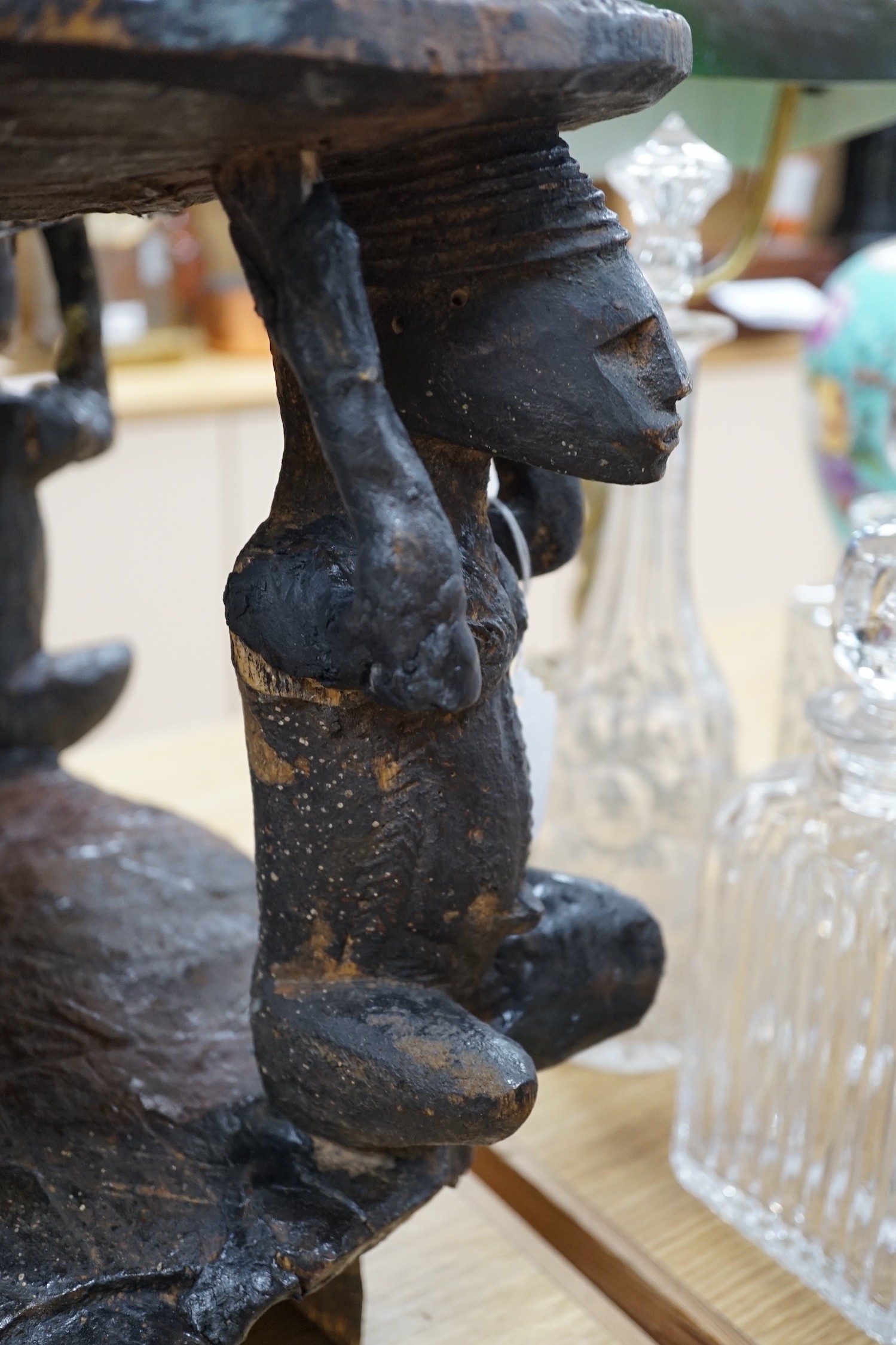 An African tribal carved hardwood chair, possibly Congo. 76cm tall